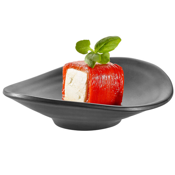 A piece of cheese on a Rosseto black melamine bowl.
