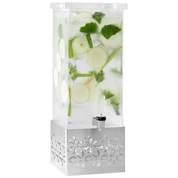 A Rosseto clear acrylic rectangle beverage dispenser with fruit slices and leaves in water.