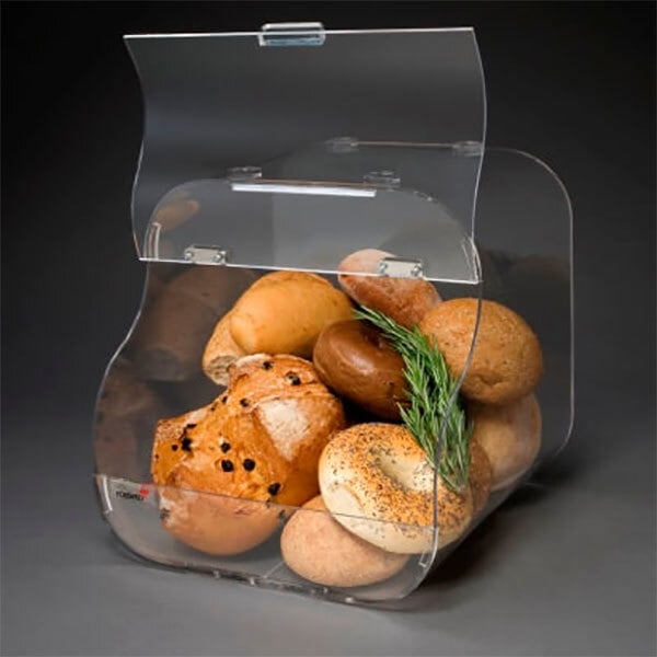 A clear container with food in it on a bakery display shelf.