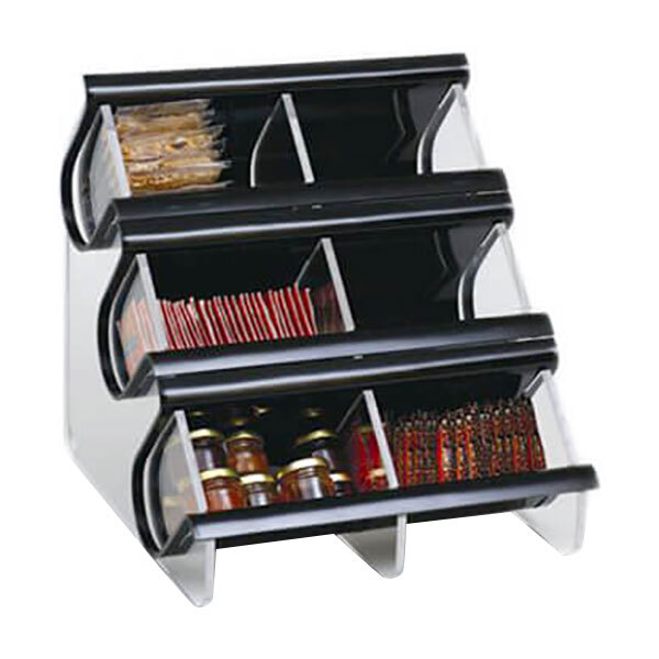 A black acrylic condiment organizer with six compartments holding different items.