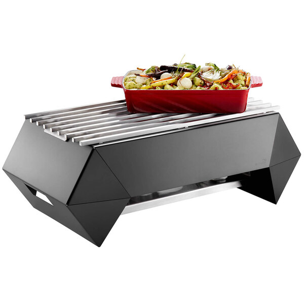 A stainless steel grill with food on it.