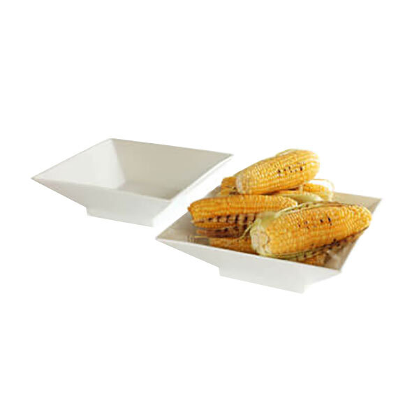 Two white square Rosseto porcelain bowls with corn on the cob.