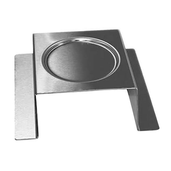 A stainless steel square burner stand with a circular design in the center.