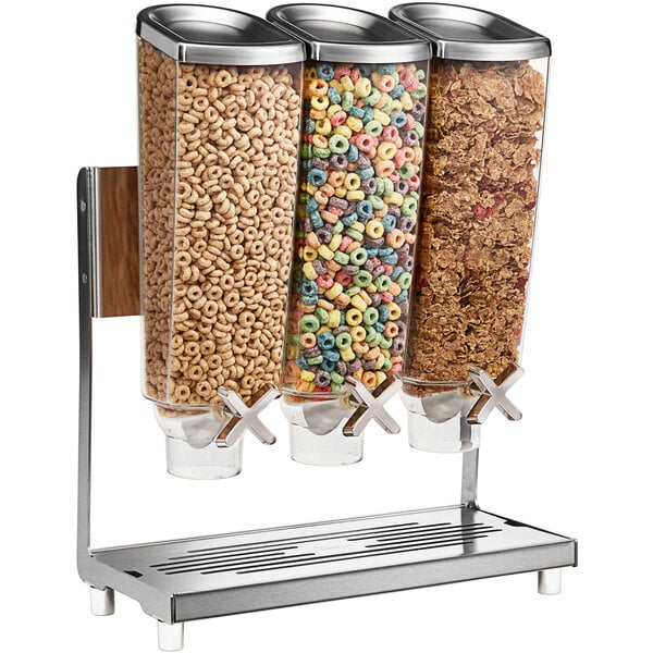 A group of Rosseto triple canister food dispensers filled with colorful cereals.