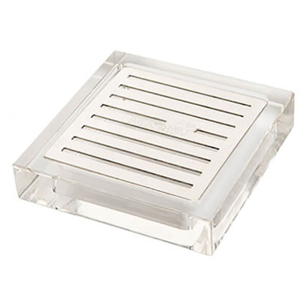 A clear square object with a metal grate.