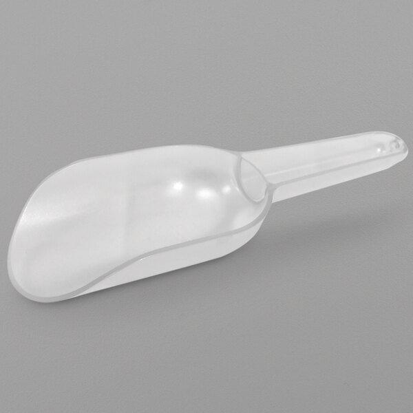 A clear plastic scoop with a handle.