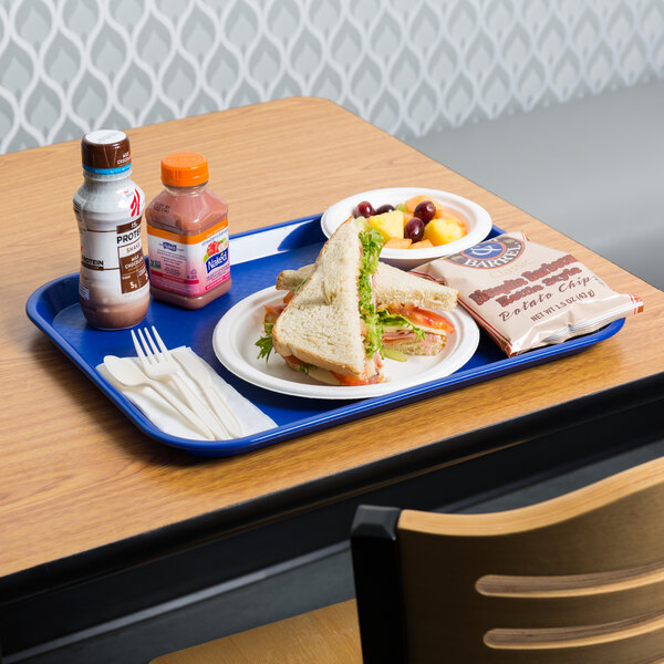A blue plastic fast food tray with food and a drink on it.