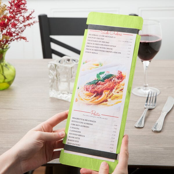 A person holding a Menu Solutions wood menu board with lime rubber band straps.