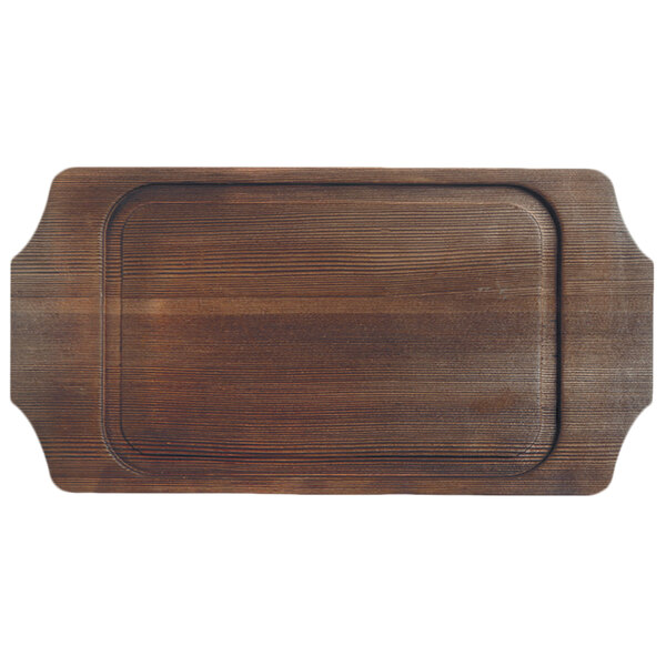 A Libbey cedar wood underliner with natural wood-grain finish on a table.