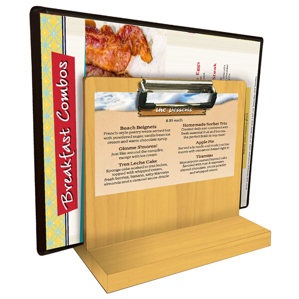 A Menu Solutions wooden tabletop menu caddy with a clip holding a menu.
