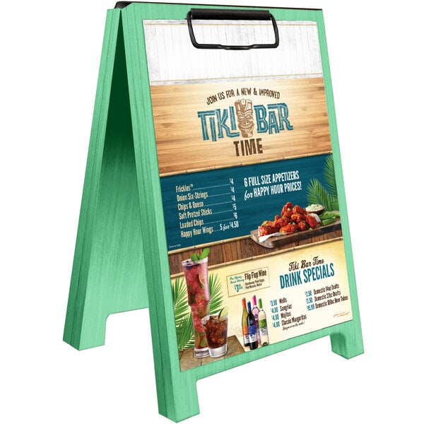 A Menu Solutions washed teal wood table tent with clip on a table.