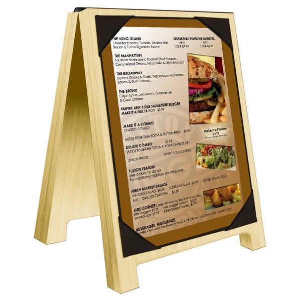 A Menu Solutions natural wood sandwich menu board with black picture corners on a table.