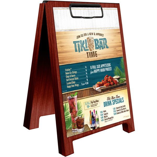 A mahogany wood Menu Solutions sandwich menu board tent on a table with a menu.