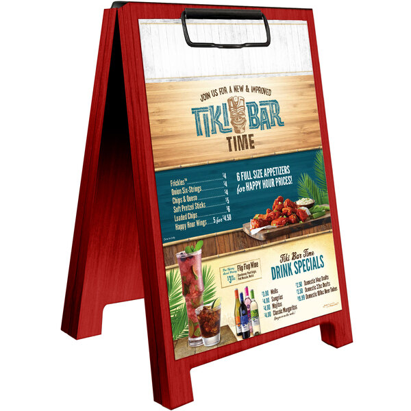 A wooden Menu Solutions Berry Wood sandwich menu board tent on a table in a cocktail bar.