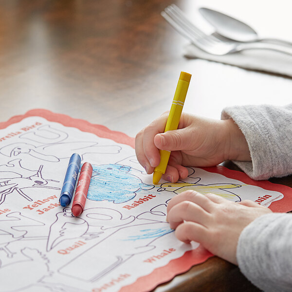 A child coloring a picture with Choice triangular kids' restaurant crayons.