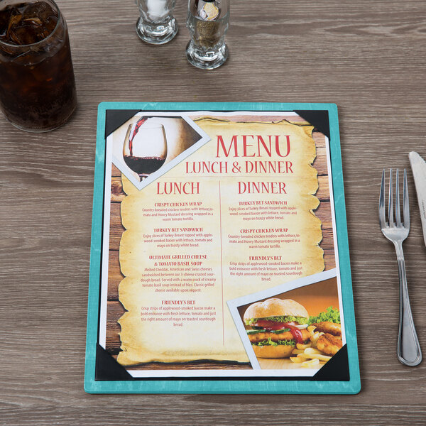 A Sky Blue wood menu board on a table with a burger and fries.