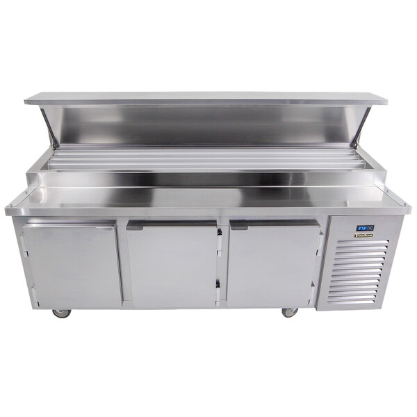 A Traulsen stainless steel refrigerated pizza prep table with 3 doors.