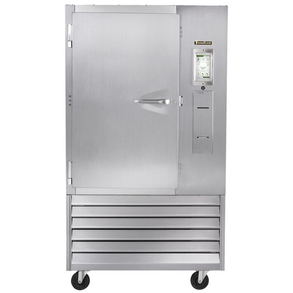 A Traulsen stainless steel commercial blast chiller with a left hinged door open.