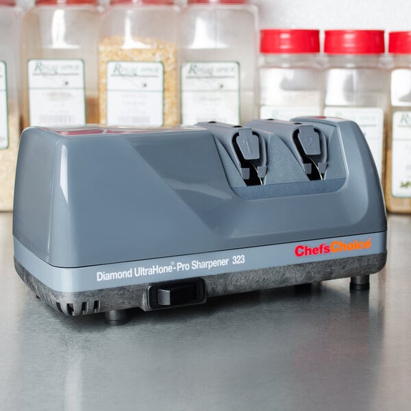 An Edgecraft Chef's Choice 323 professional knife sharpener on a counter.