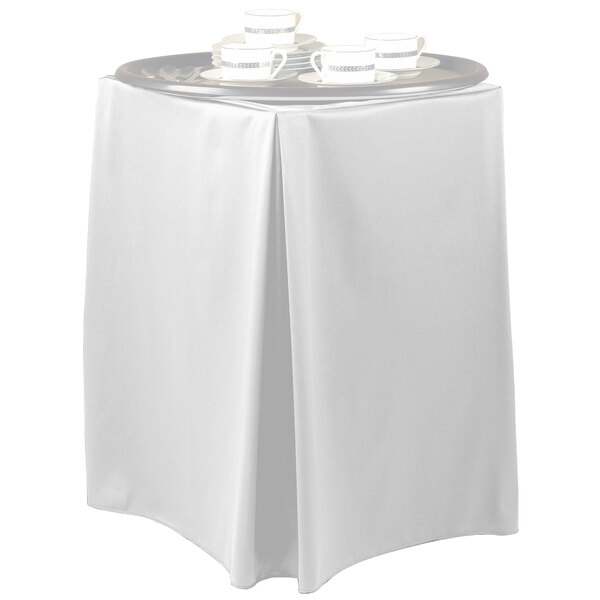 A white table with a white Wyndham tray stand cover.