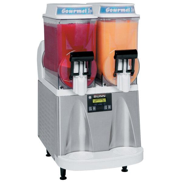 A Coastal white Bunn Ultra-2 HP granita machine with two containers of frozen drinks.