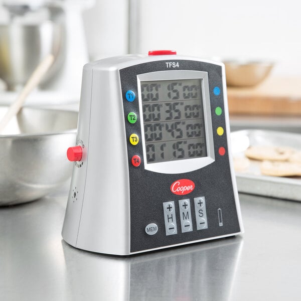 A Cooper-Atkins digital kitchen timer on a counter.