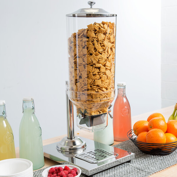 A white table with a Choice cereal dispenser full of cereal.
