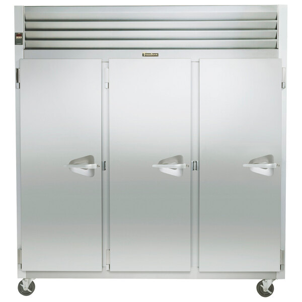 The left hinged white door of a Traulsen G31313 G Series reach-in freezer.