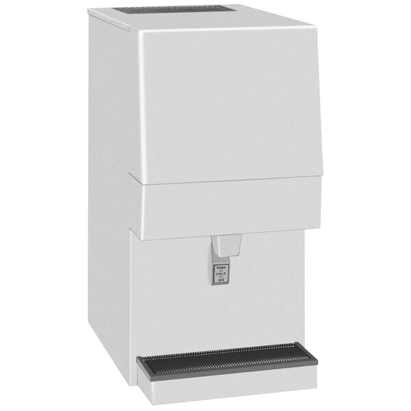 A white Cornelius ice maker and dispenser with a black rectangular label.