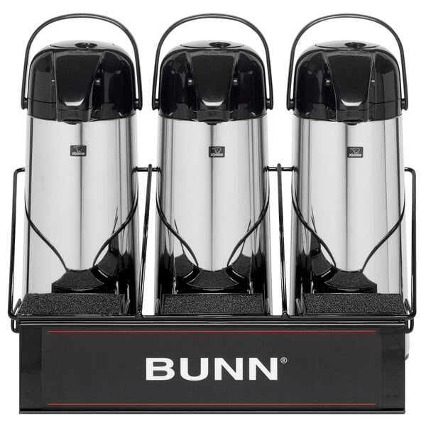 A Bunn three section airpot serving rack on a counter holding three airpots.