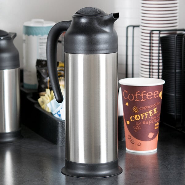 A stainless steel Choice coffee carafe on a counter.