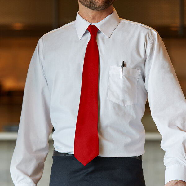 A man wearing a red Henry Segal straight neck tie and a white shirt.