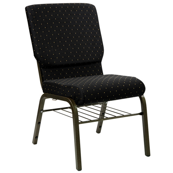 A black church chair with a black and gold dot patterned fabric on the backrest.