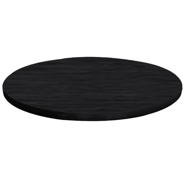 A black circular brushed aluminum table cover on a table with a white background.