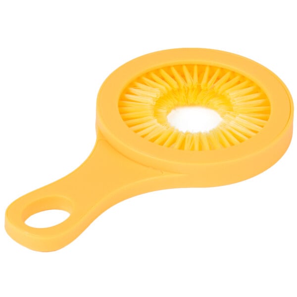 A yellow circular Weston Desilker Corn Brush with bristles.