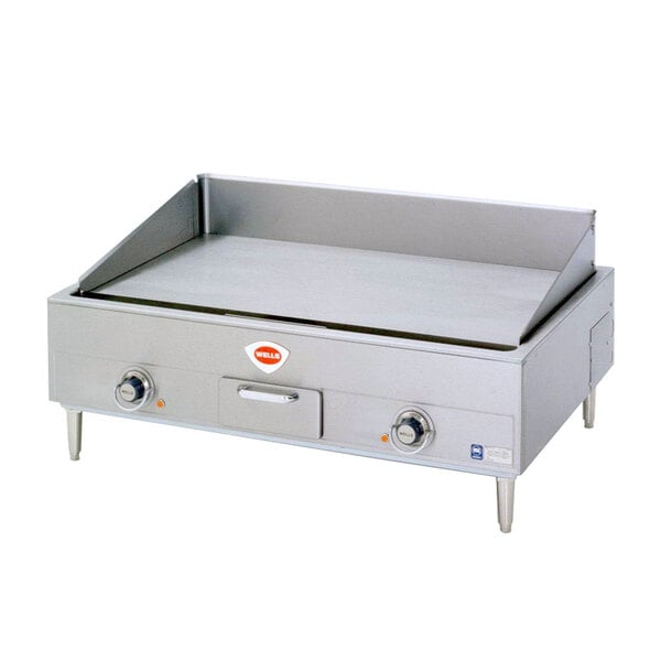 A large stainless steel Wells countertop electric griddle.