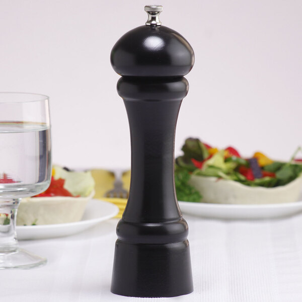 A Chef Specialties Windsor ebony finish pepper mill on a white table