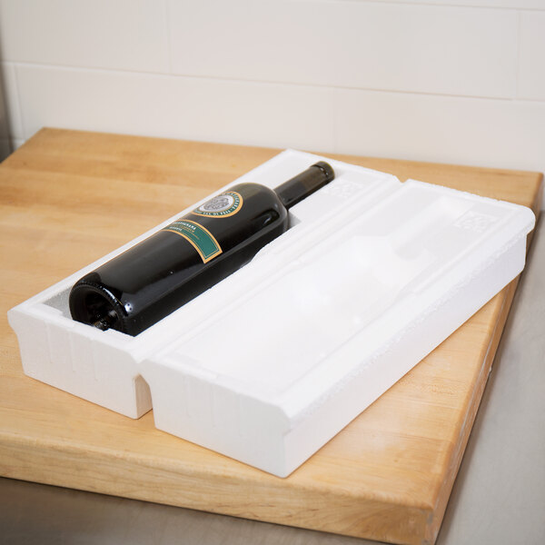 A bottle of wine in a Polar Tech styrofoam box.