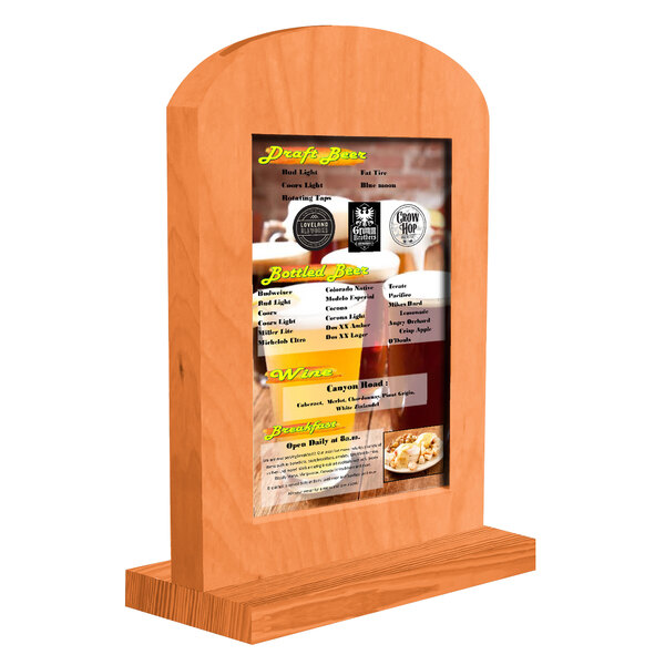 A Menu Solutions wooden arched table tent with a menu on it.