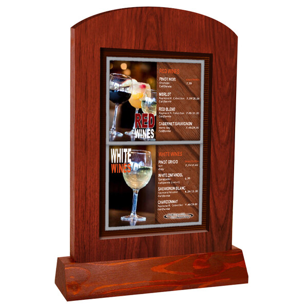 A Mahogany arched wood menu tent on a table with a menu of wine glasses.