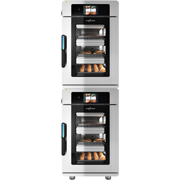 A room with two large Alto-Shaam Vector multi-cook ovens, each with different food inside.