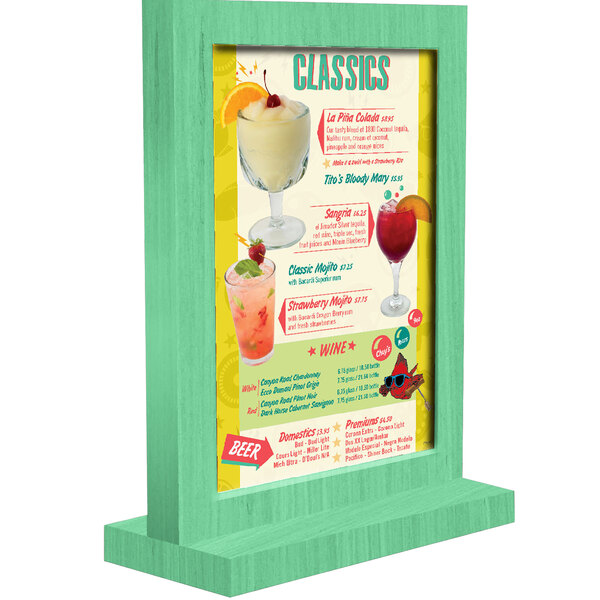 A Menu Solutions washed teal wooden table tent with a white display.
