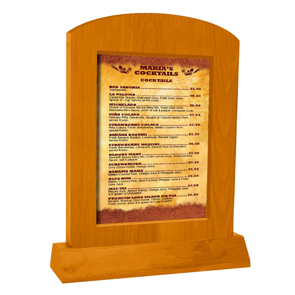 Menu Solutions Country Oak Arched Wood Menu Tent with an angled base holding a menu on a wooden stand.