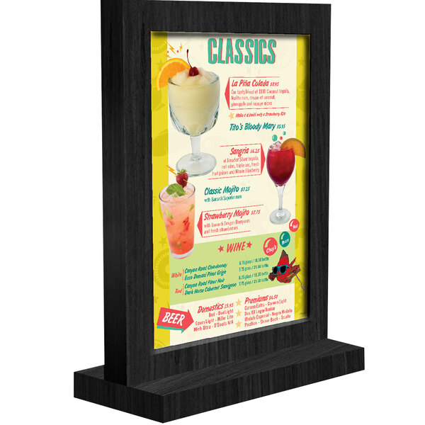 A black framed wood menu tent with a white background and drinks displayed.