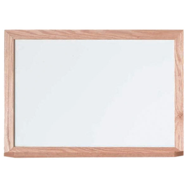A whiteboard with a wooden frame.