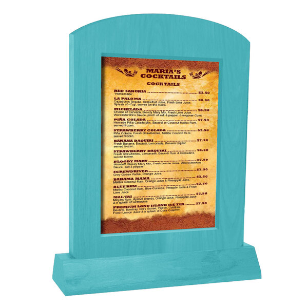 A Menu Solutions sky blue arched wood menu tent on a table with a menu in it.