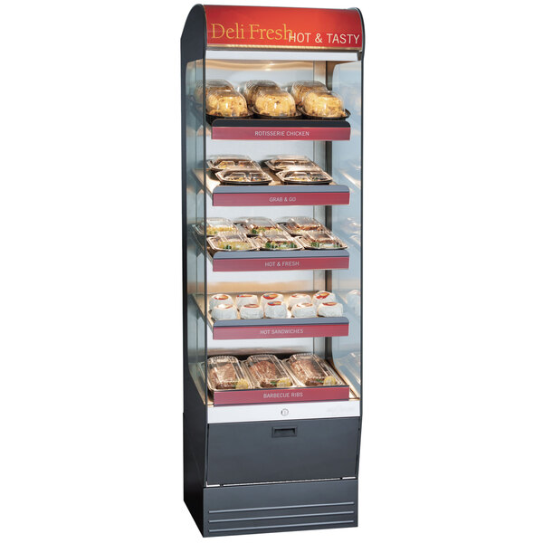 An Alto-Shaam heated display case on a counter with trays of food inside.