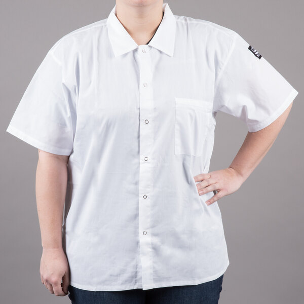 A woman wearing a white Chef Revival cook shirt.