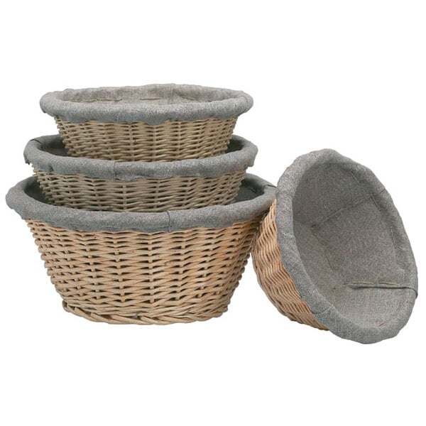 A stack of Matfer Bourgeat wicker baskets with grey liners.