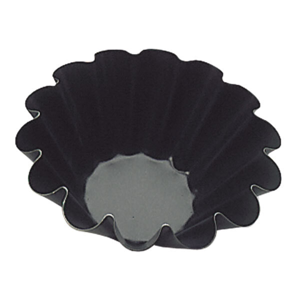 A black baking dish with fluted edges.